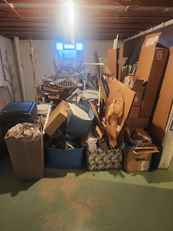 Roll-off dumpster container at job site for 2 Yard Dumpster Rental in Wellsboro