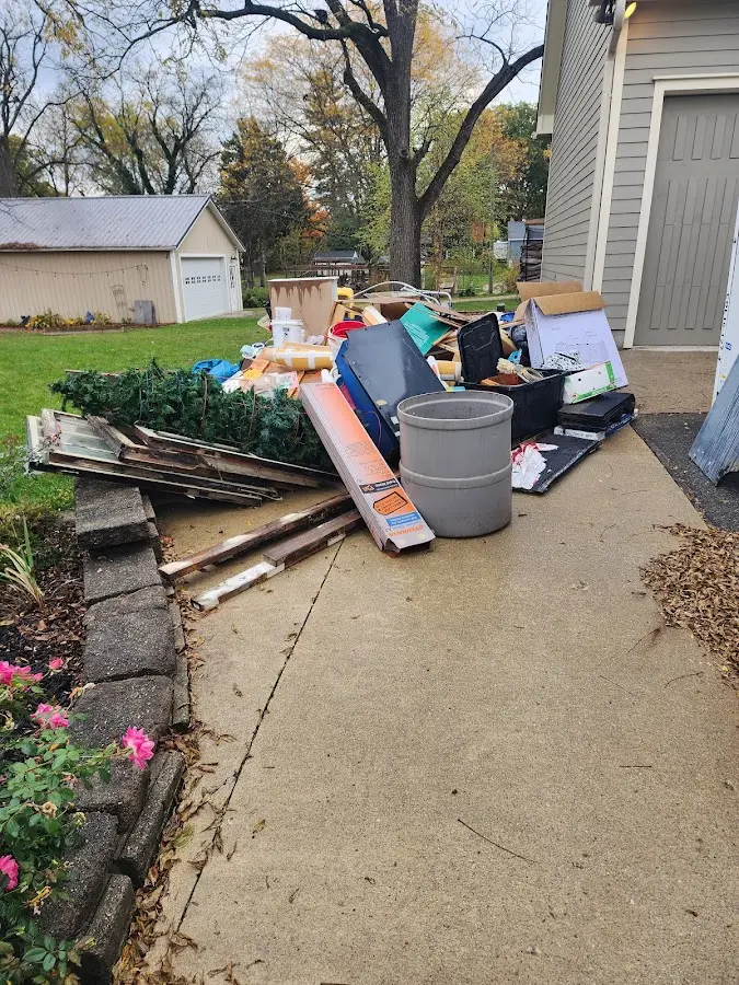 Dumpster being loaded with debris for 30 Yard Dumpster Rental in Wellsboro
